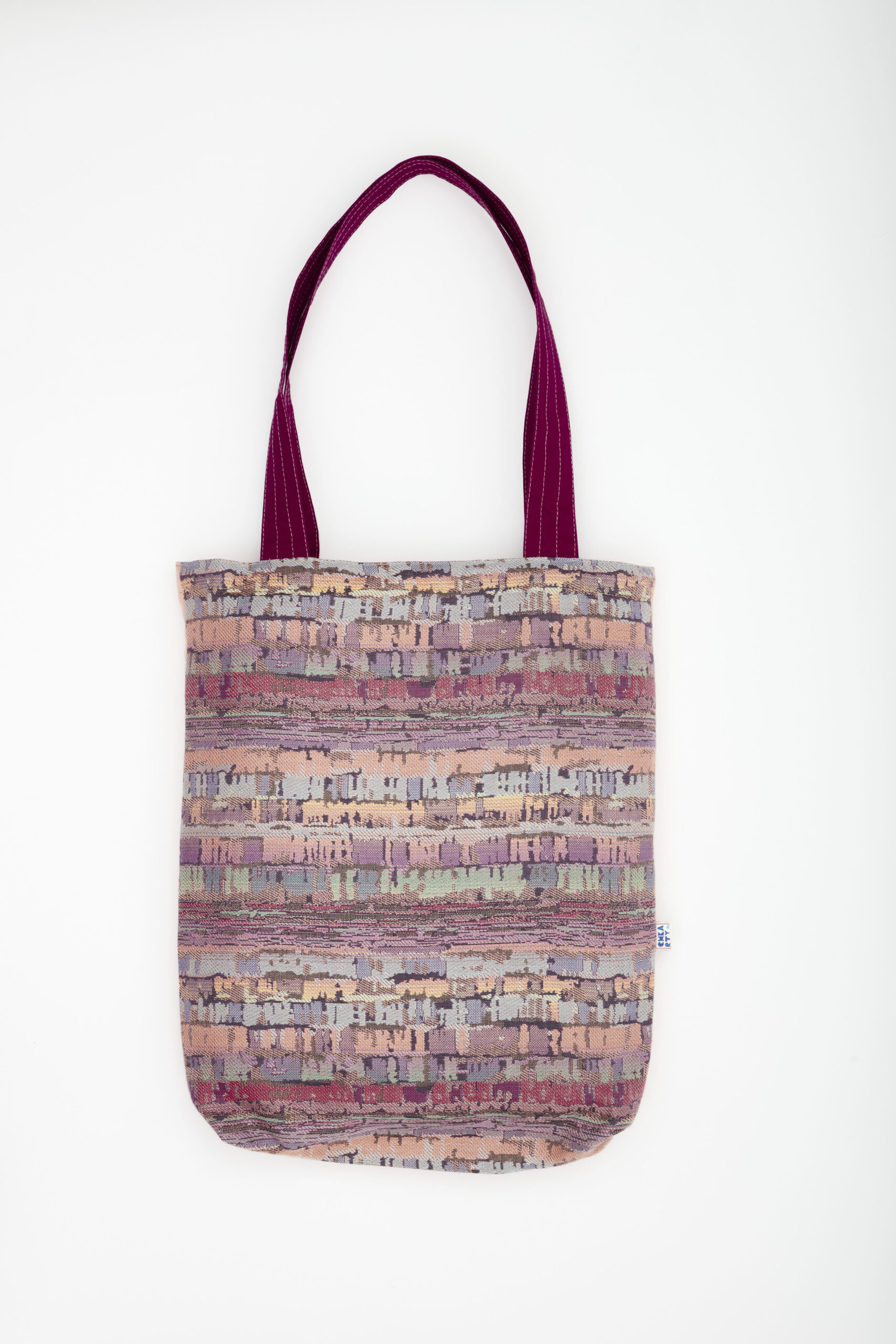Totebag écoresponsable réversible fait main en Tunisie – motif floral oiseau prune et tissu pastel texturé – Chkarty